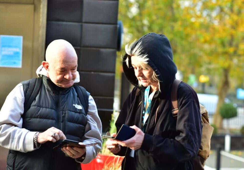 Tracey and Adrian on mobiles